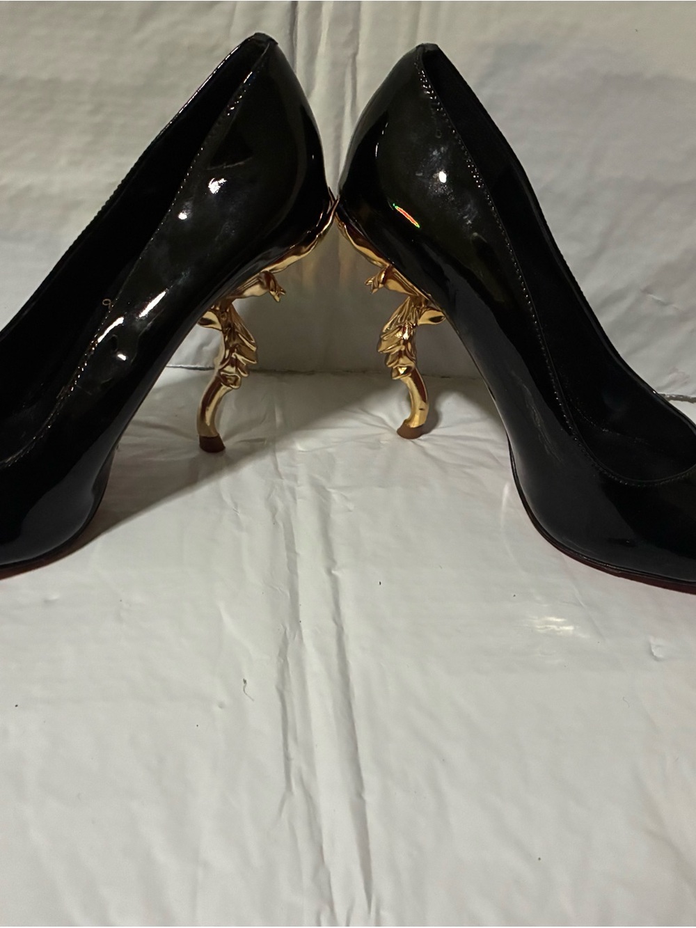 Authentic Christian Louboutin Black “Belle” pumps with Sculpted Gold Flower heel